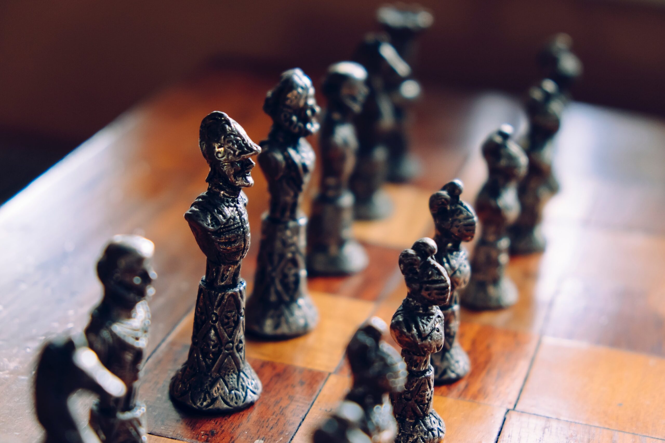 Stone chess pieces stand on gaurd