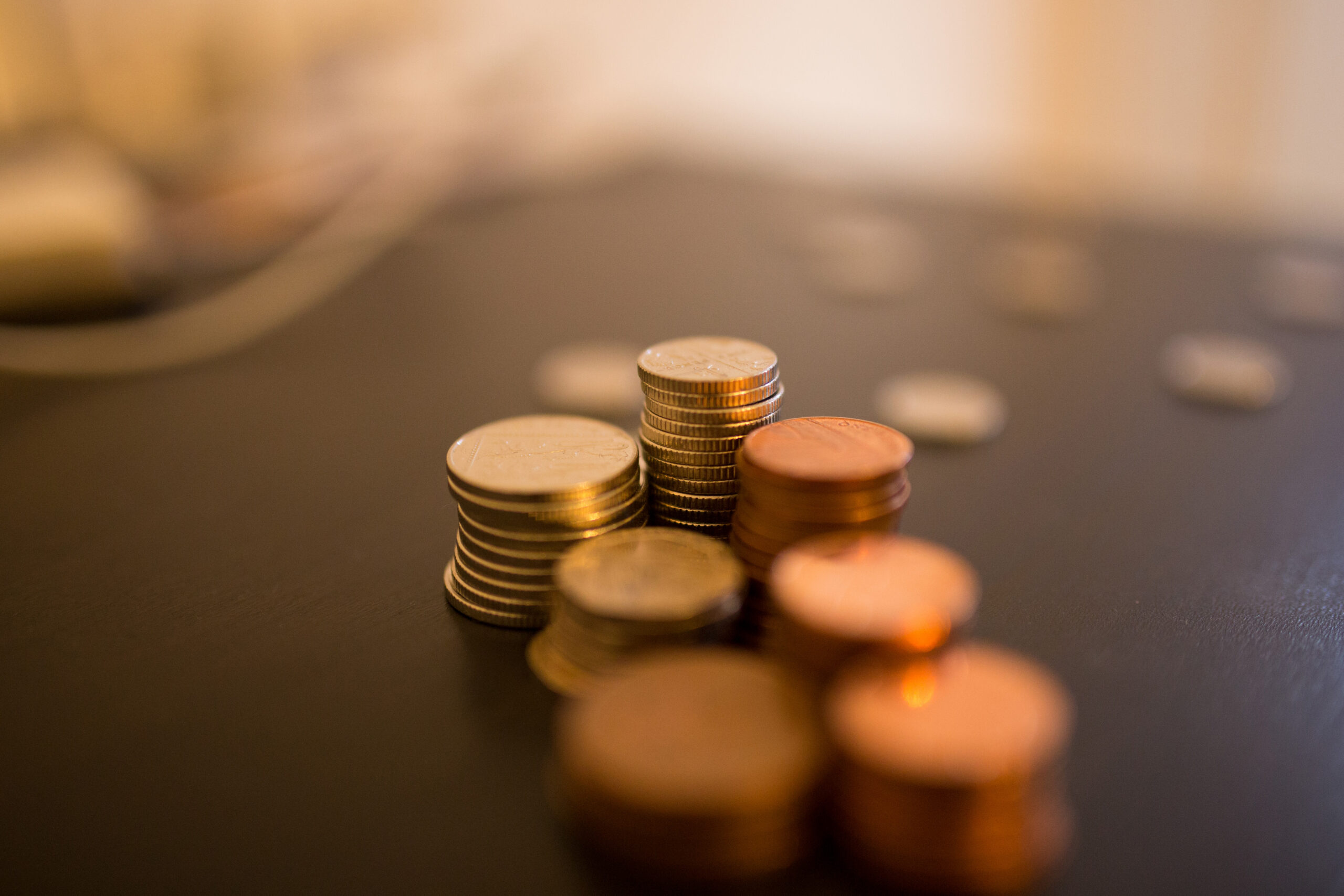 a closeup shot of stacks of various coins