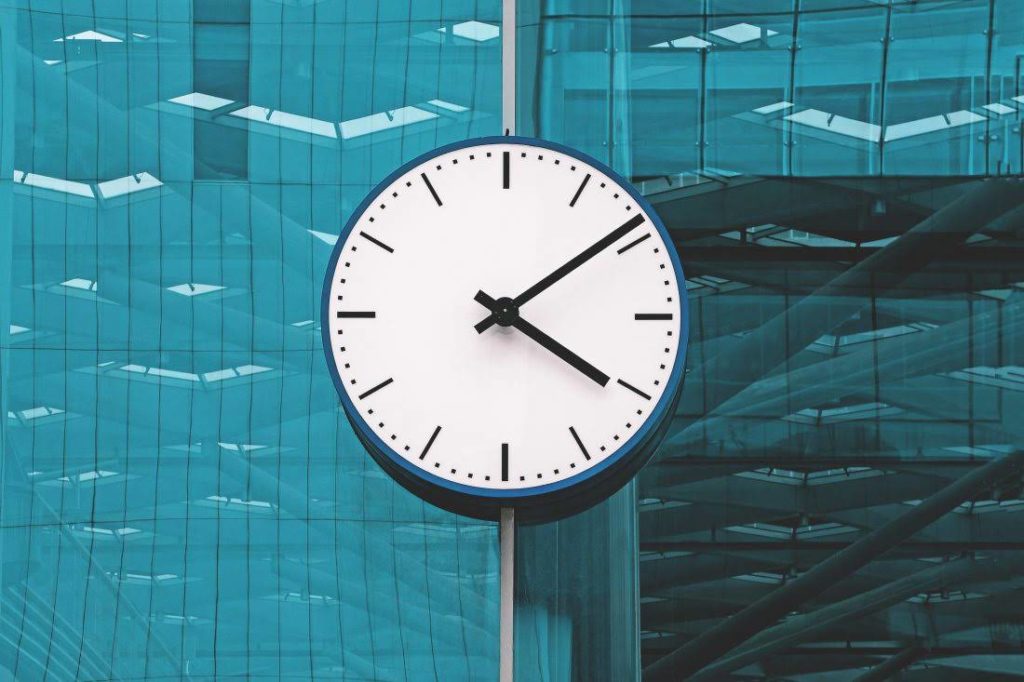 large clock on side of office tower