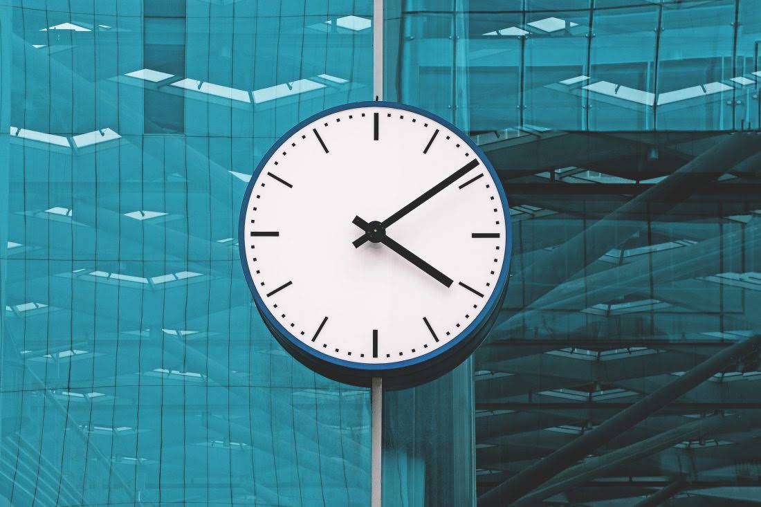 large clock on side of office tower