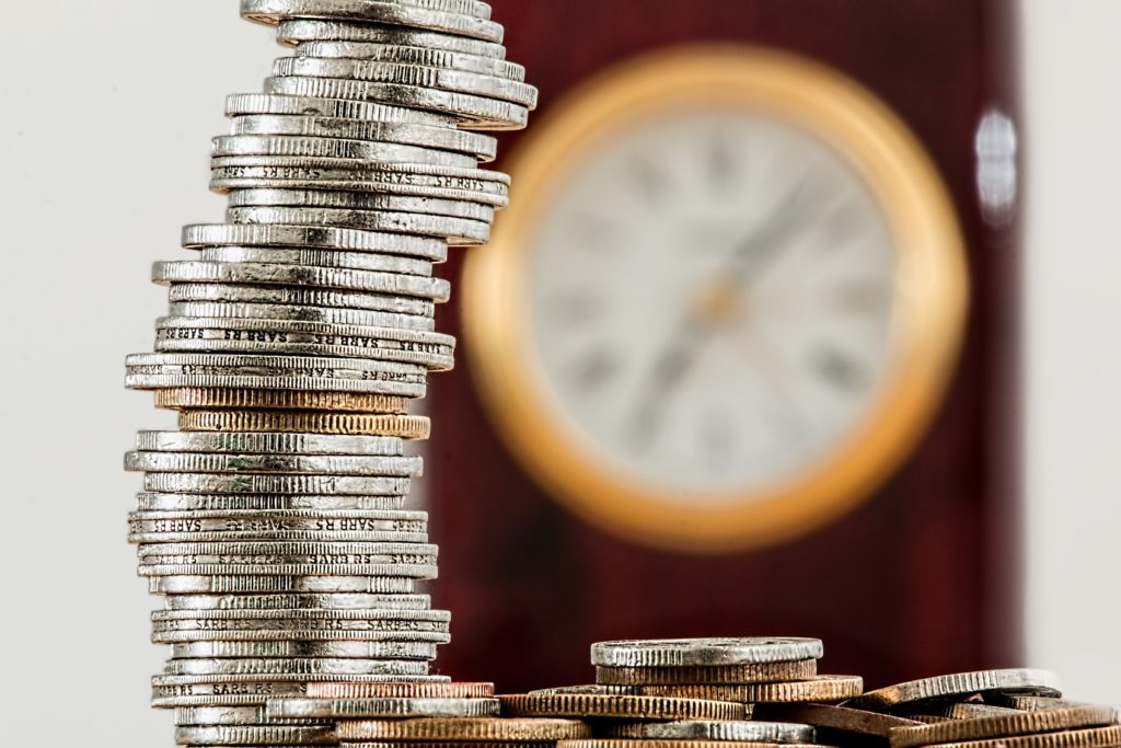 a stack of coins representing settlement money in litigation