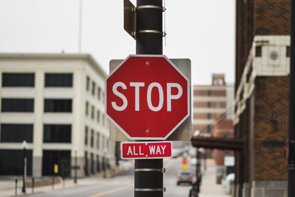 Stop sign representing issue and action estoppel in litigation.