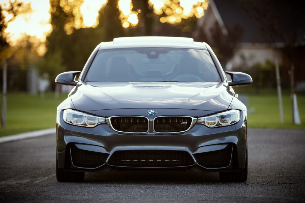 A luxury car in a driveway representing assets that can be frozen with a Mareva injunction