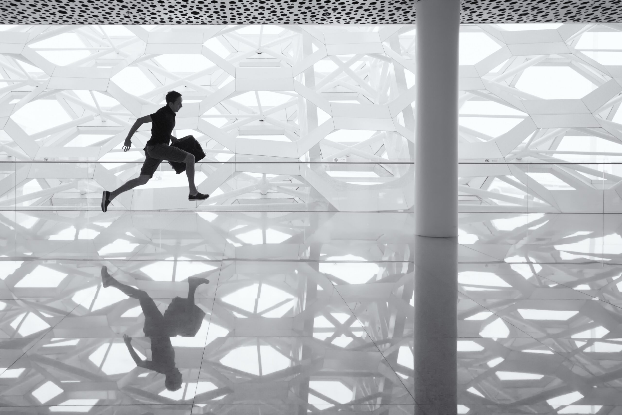 A man running with a bag, representing a person late to respond to a motion for default judgment