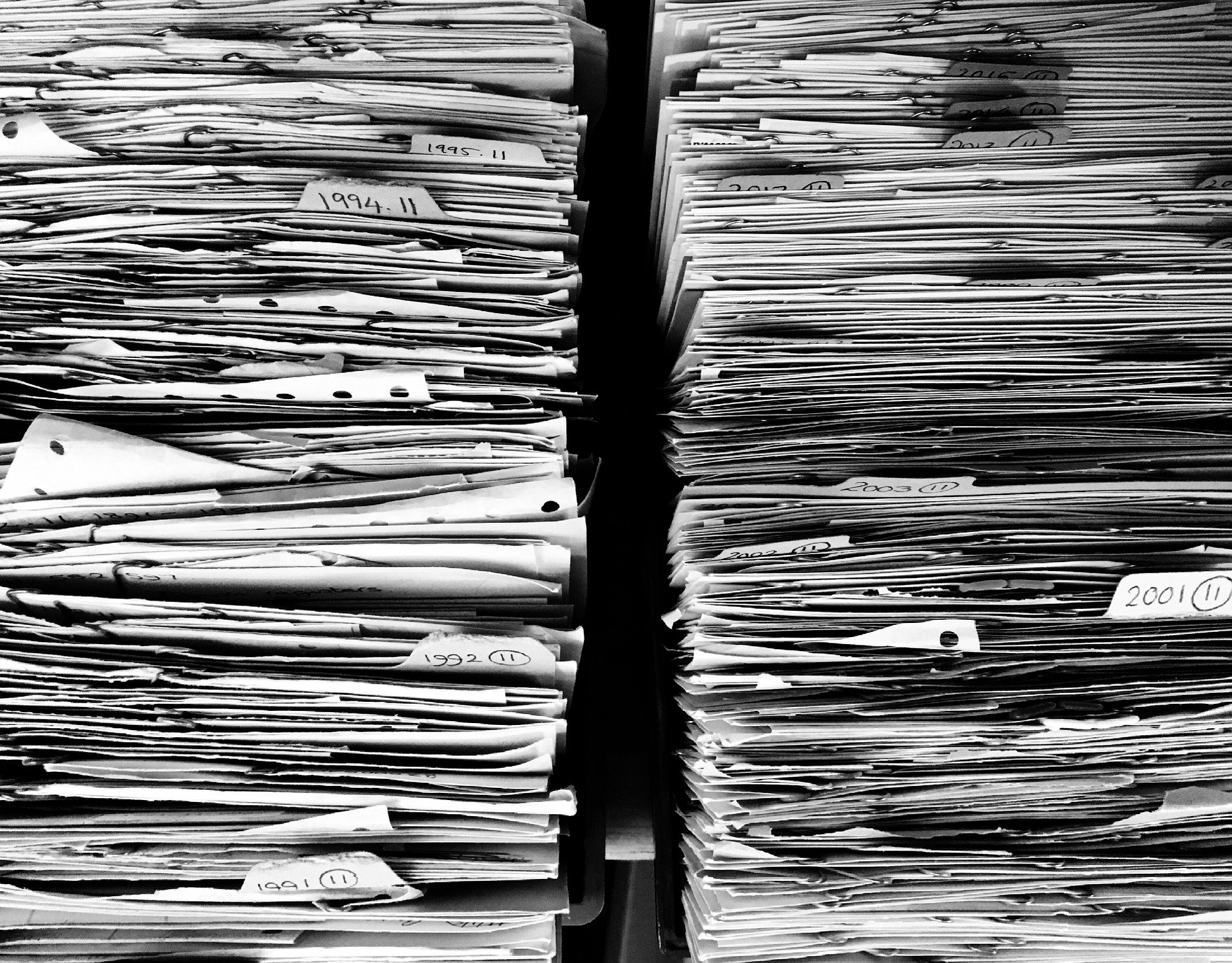 Stacks of documents representing evidence sought via a Norwich order