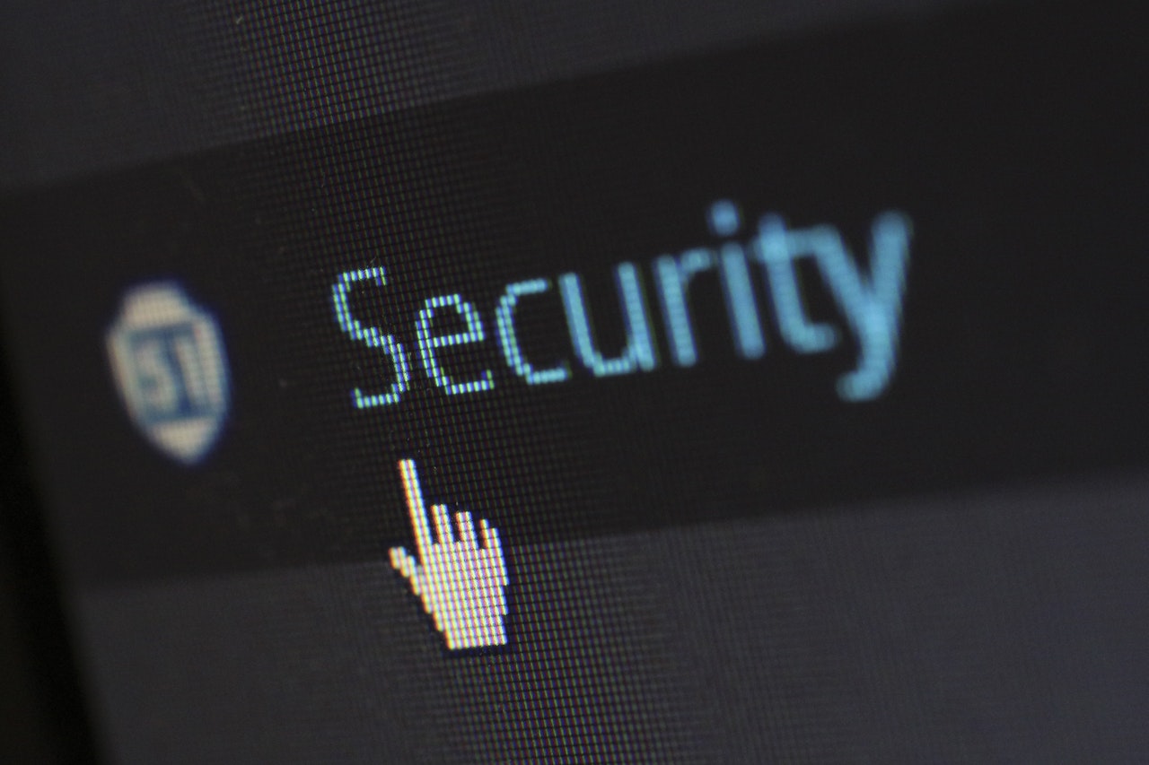 A cursor pointing at the word "Security" on a computer screen representing security for costs