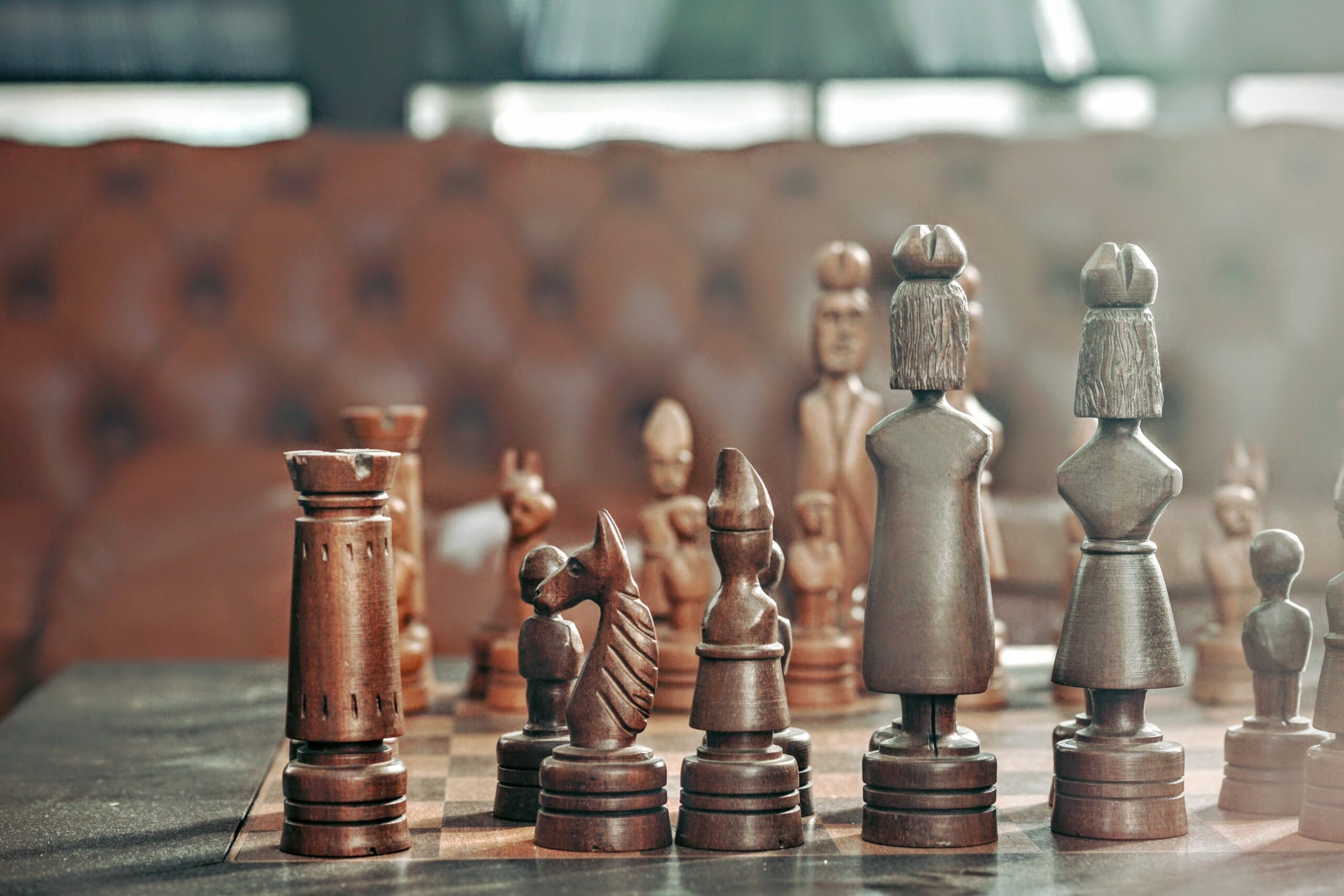 A wooden chess set representing litigation and the various moves that can be made by the participants