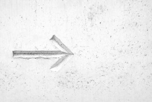 A right facing arrow in a wall representing extending a deadline