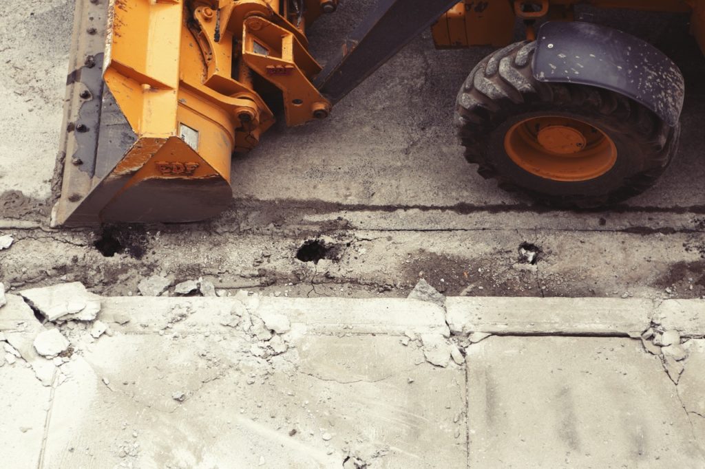 Construction equipment working on repaving a road