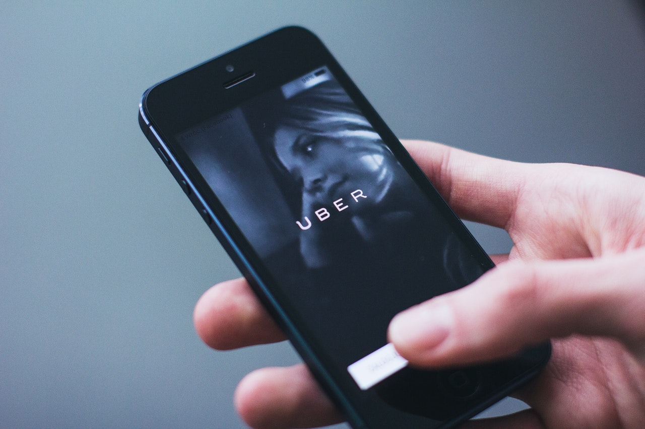 A smartphone screen showing the Uber app, representing a class action where an arbitration clause was overruled.