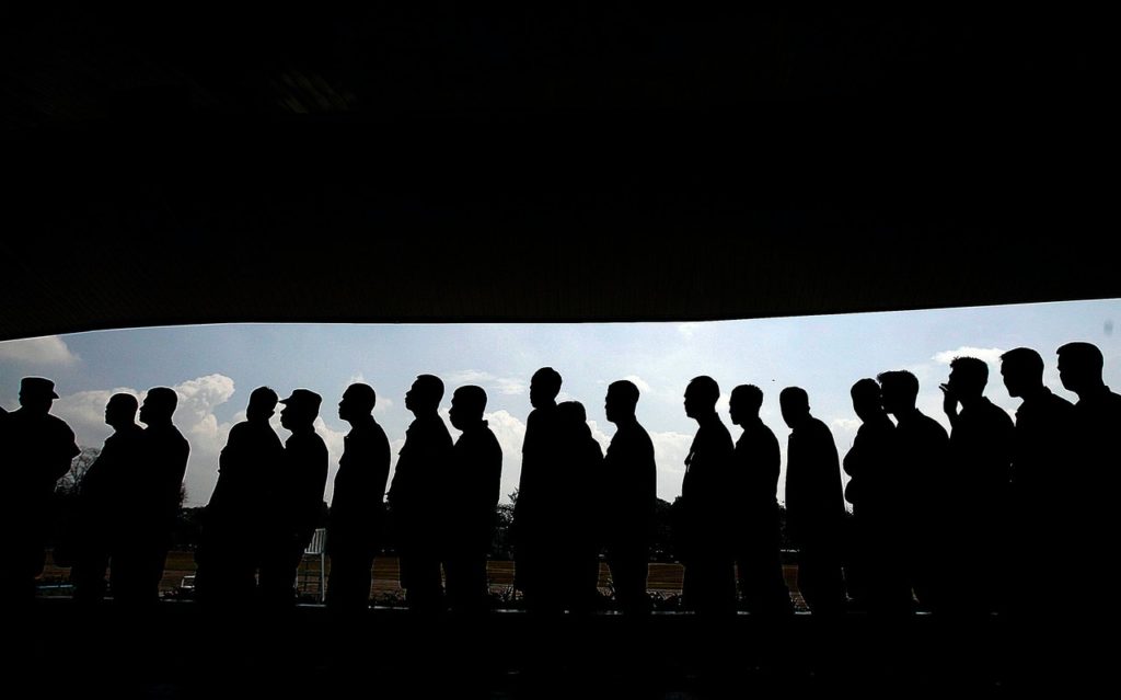 A line of people in silhouette representing a class action