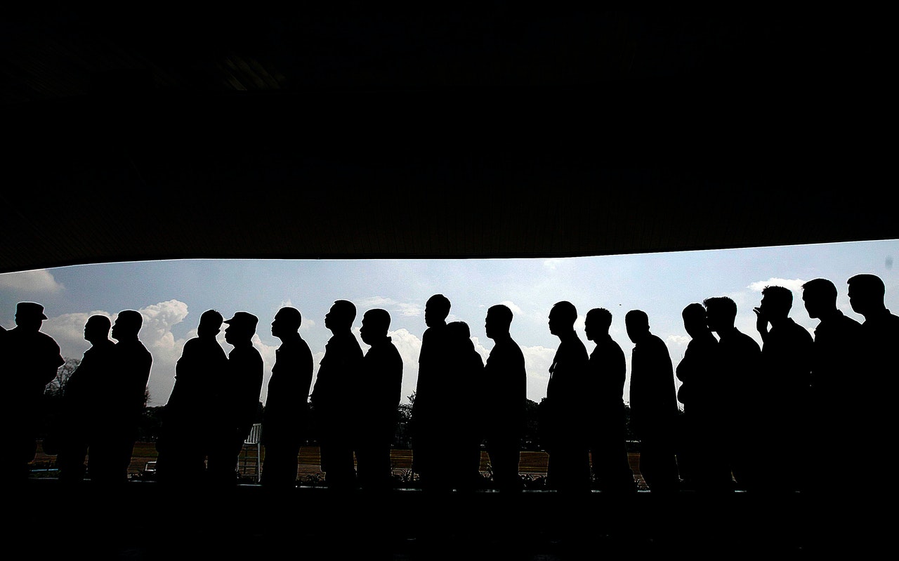 A line of people in silhouette representing a class action