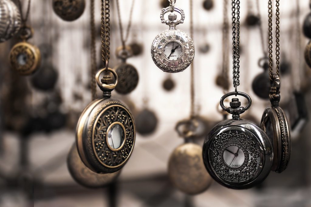 Several pocketwatches hanging from their chains representing limitation periods in a class action.