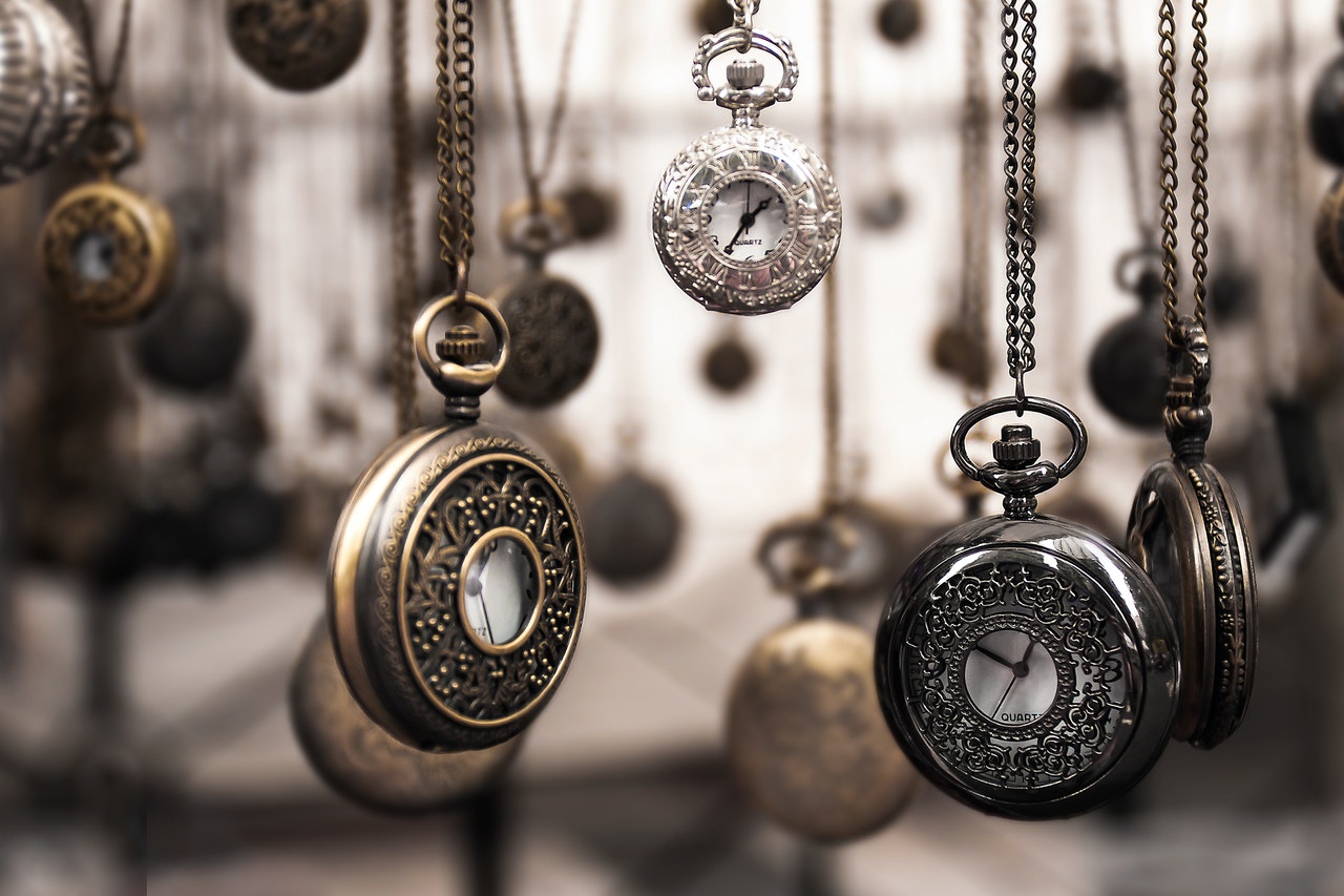 Several pocketwatches hanging from their chains representing limitation periods in a class action.