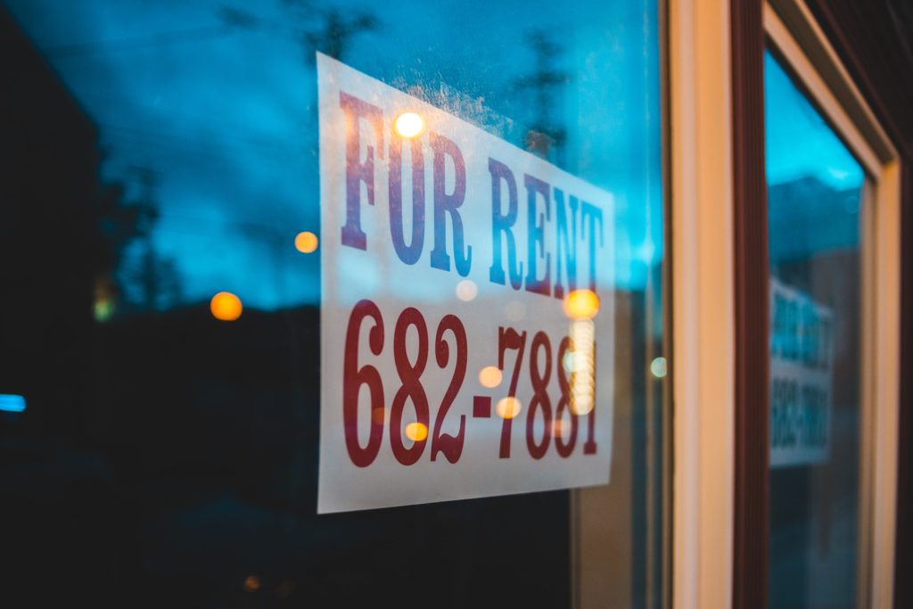 A for rent sign in a commercial building representing a fraud claim against a commercial landlord