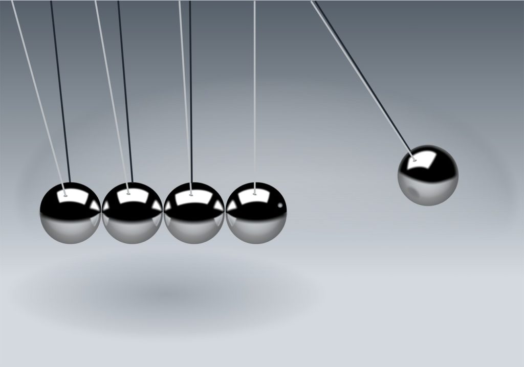 A Newton's Cradle toy representing cause and effect and the concept of causation in litigation