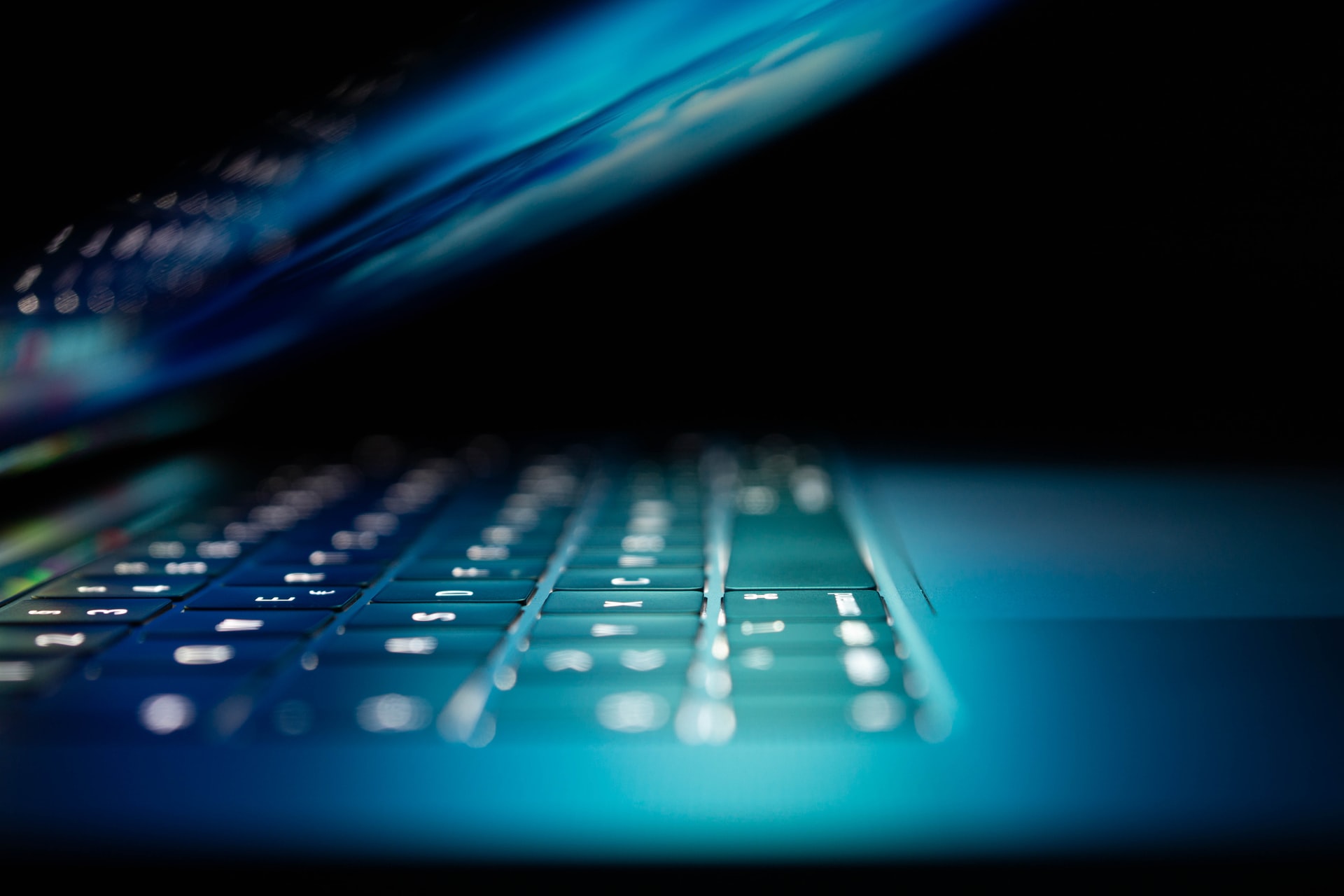 A laptop in the dark representing Ontario's new tort of internet harassment
