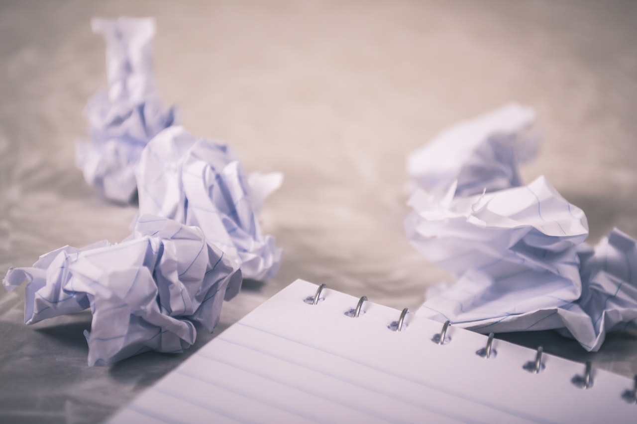 Crumpled papers representing a court's rejection of a proposed settlement in a recent class action
