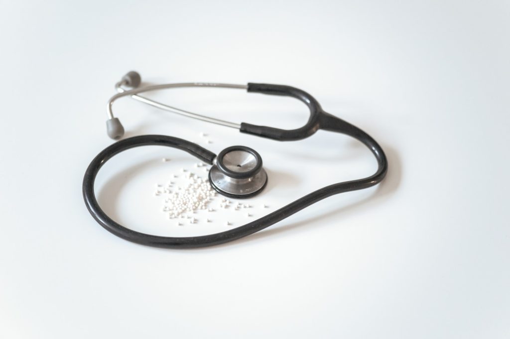 nurse stethoscope and white pills