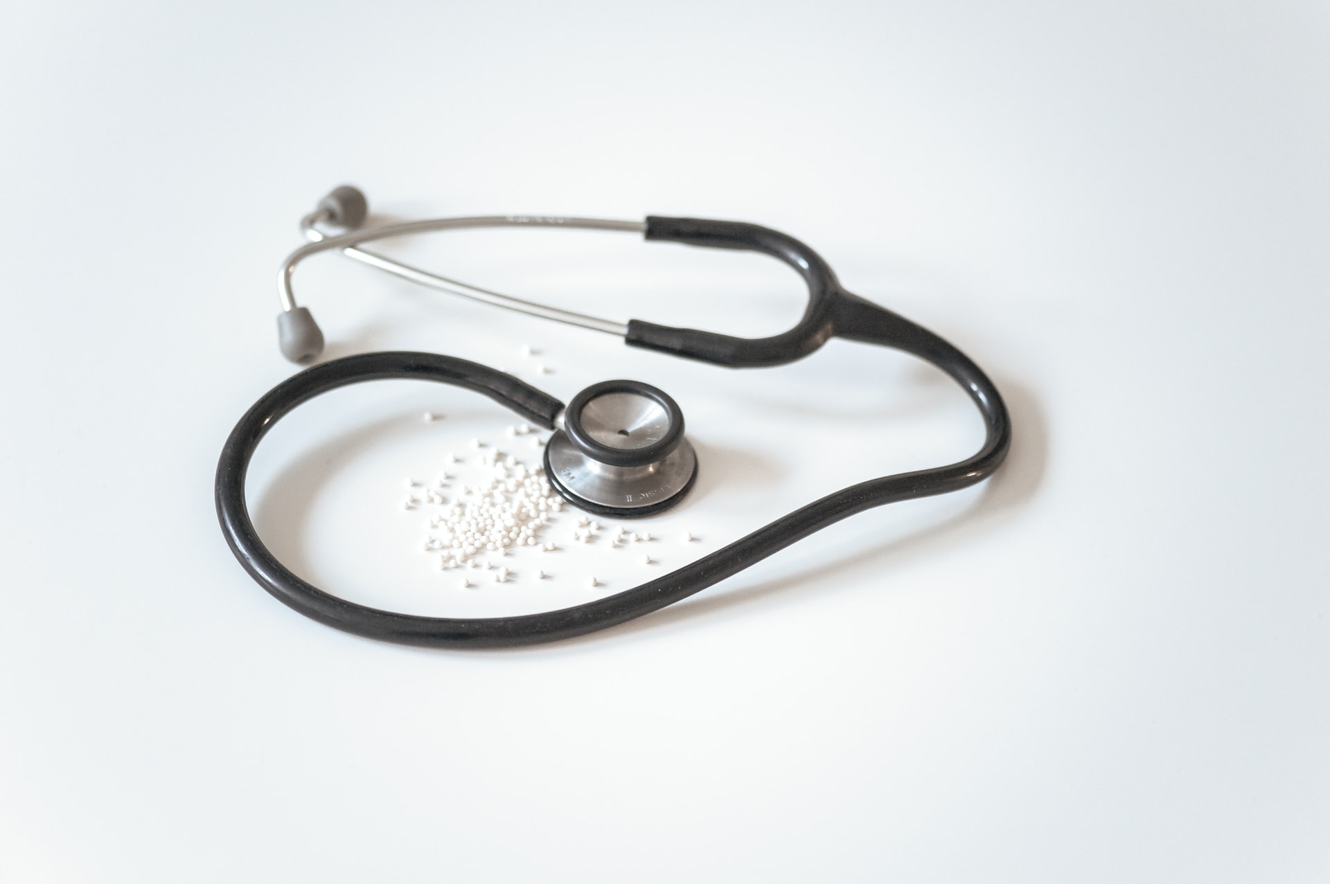 nurse stethoscope and white pills