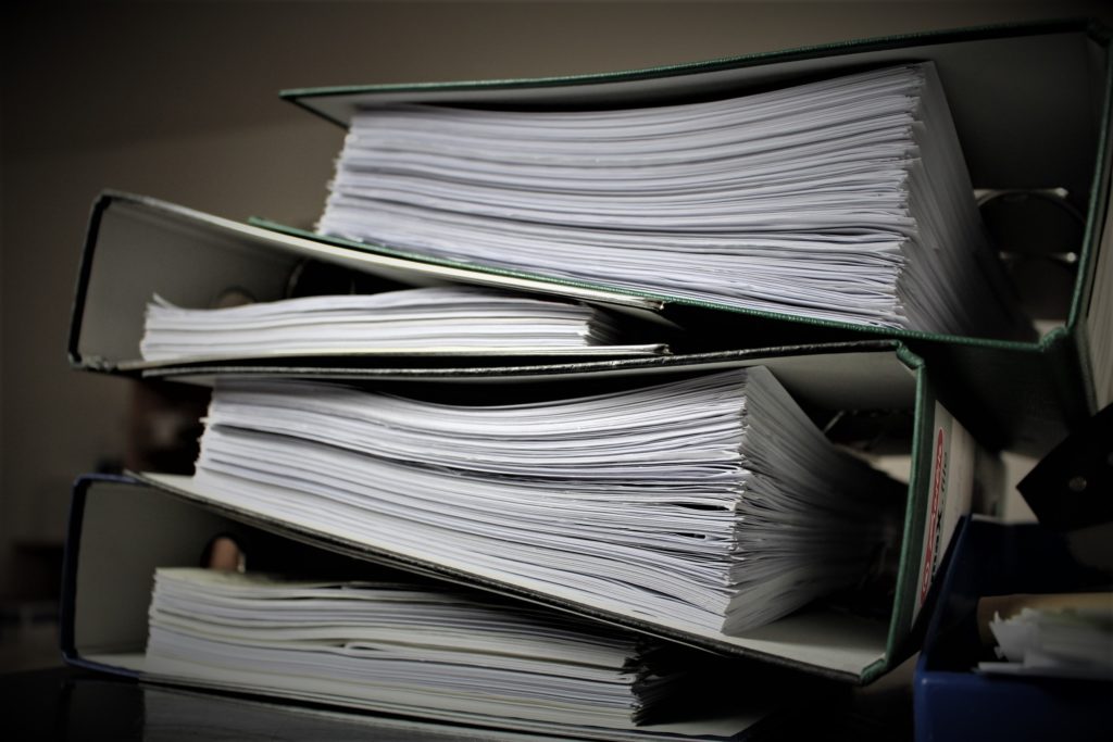 large binders representing punitive damages awarded to plaintiff