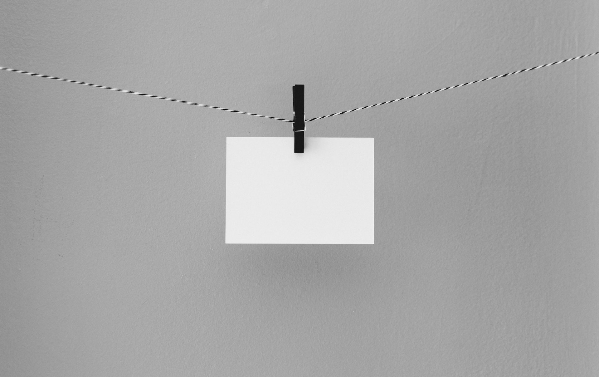 hanged white printing paper photo