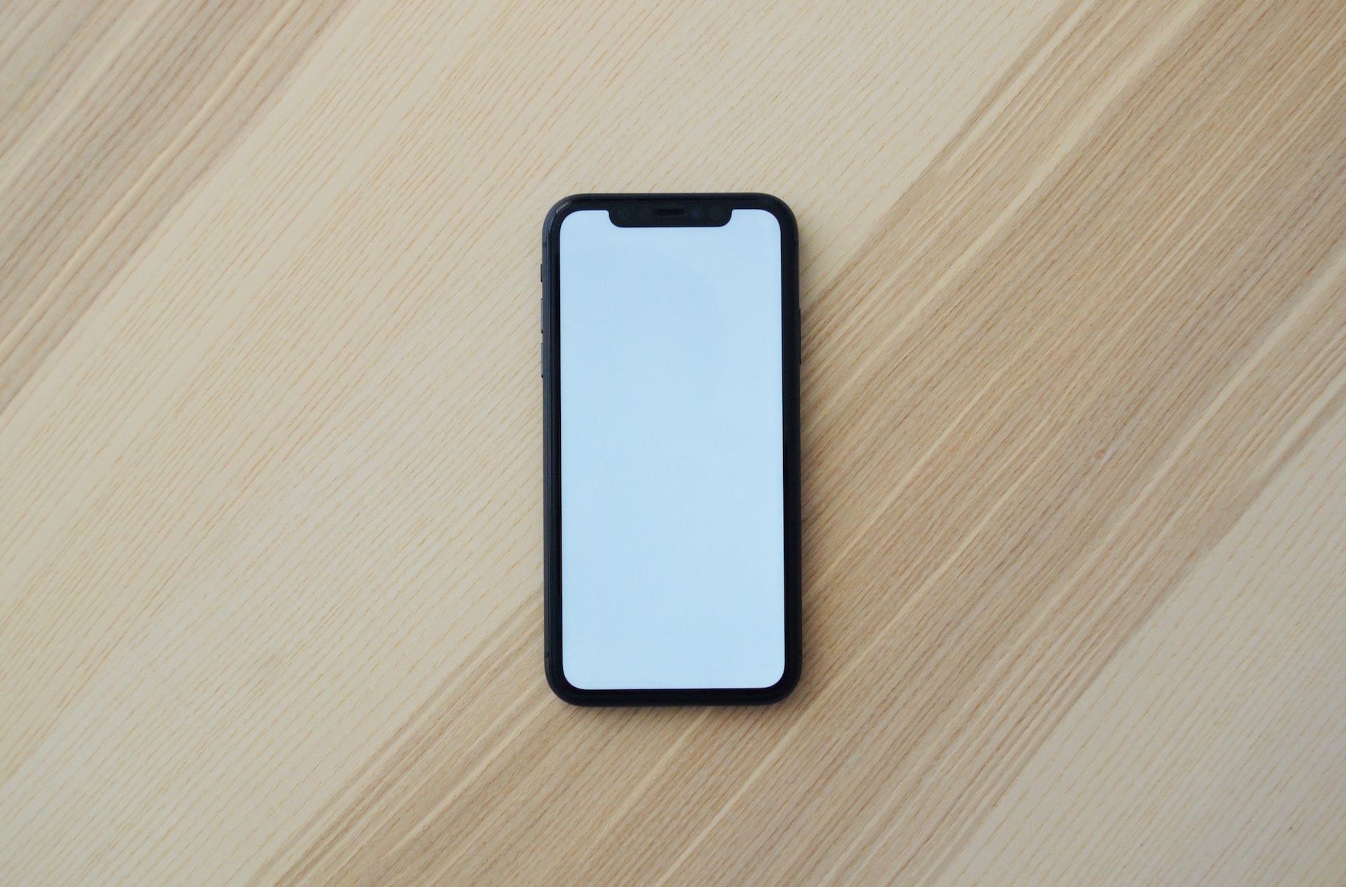 white smartphone sitting on counter