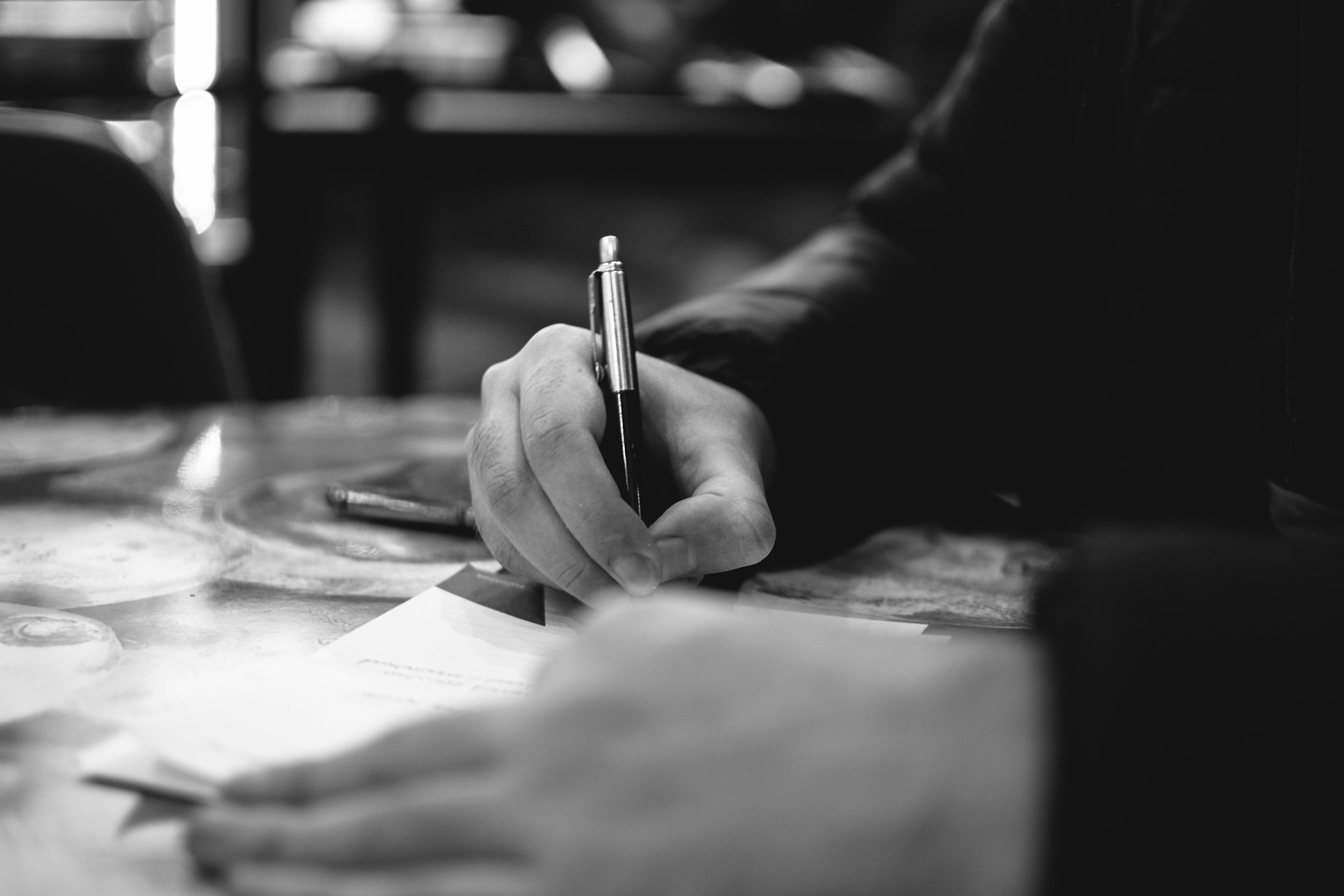 person writing on paper