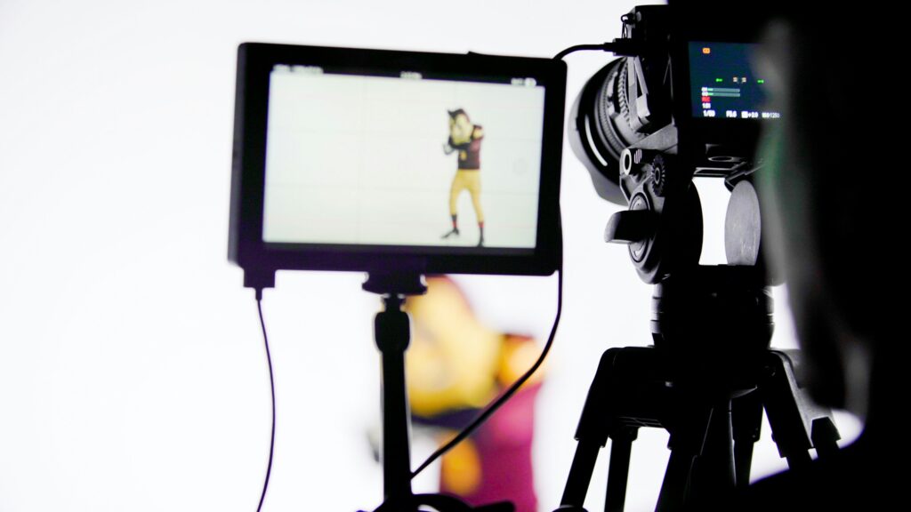 Close up of film camera on a white set, representing the William Santor and Productivity Media Inc. civil fraud case
