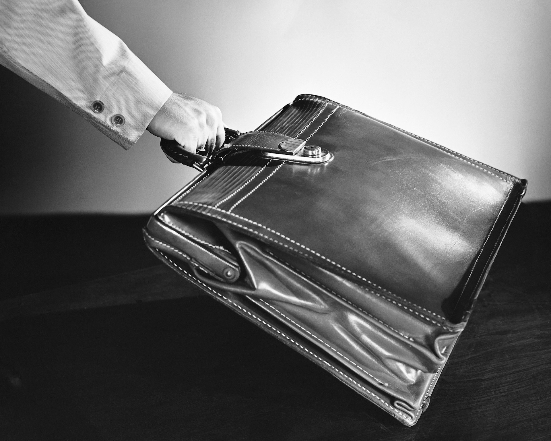 a person holding a briefcase