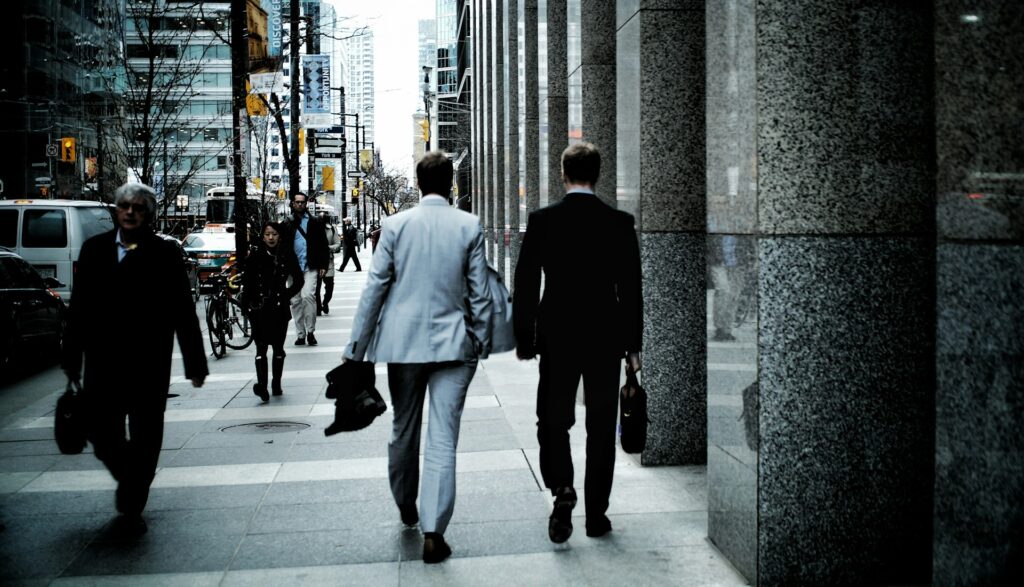 View of two business men walking away from camera in downtown Toronto, representing Limited Partnerships and profit distribution rights in Ontario