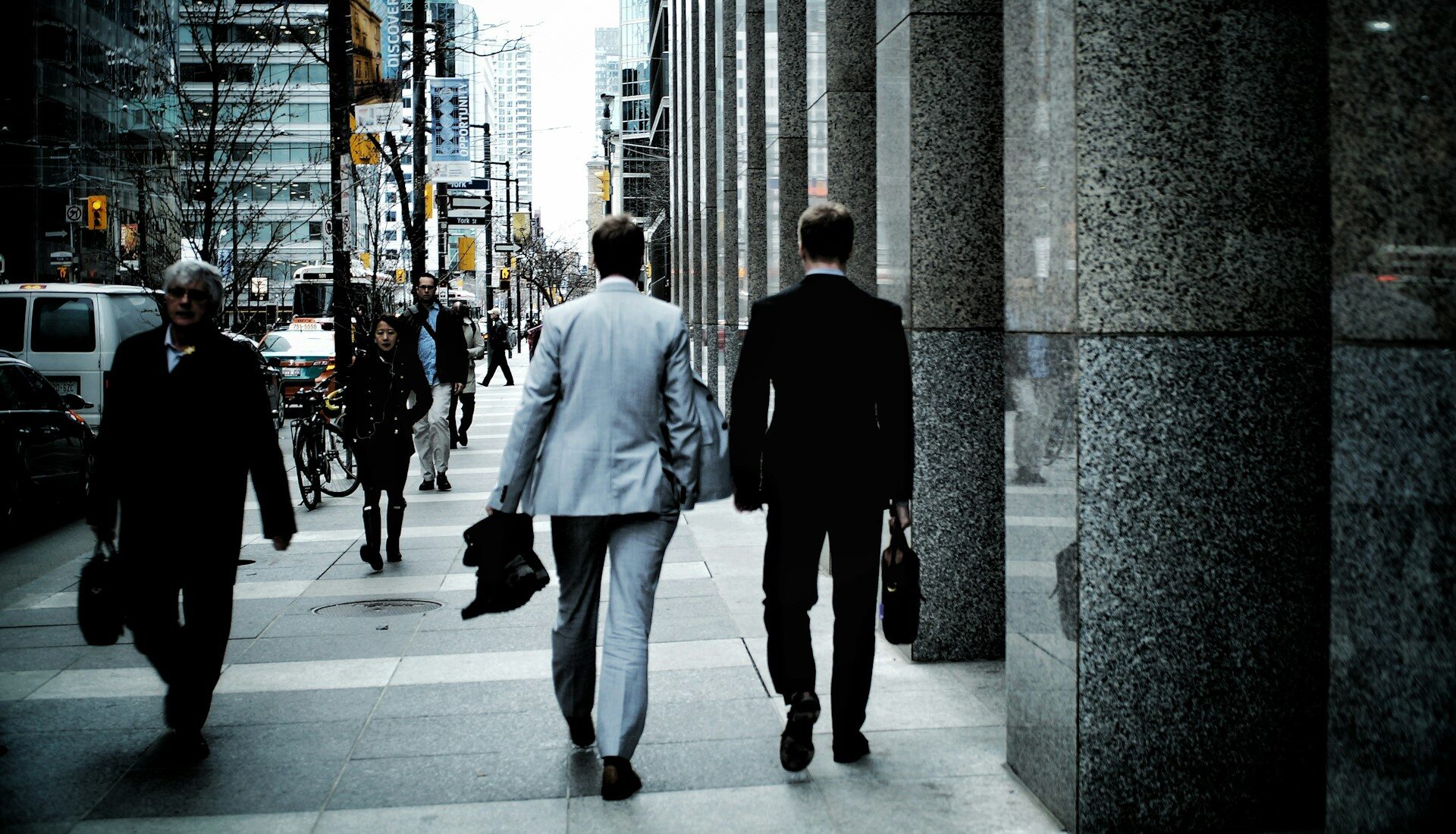 View of two business men walking away from camera in downtown Toronto, representing Limited Partnerships and profit distribution rights in Ontario