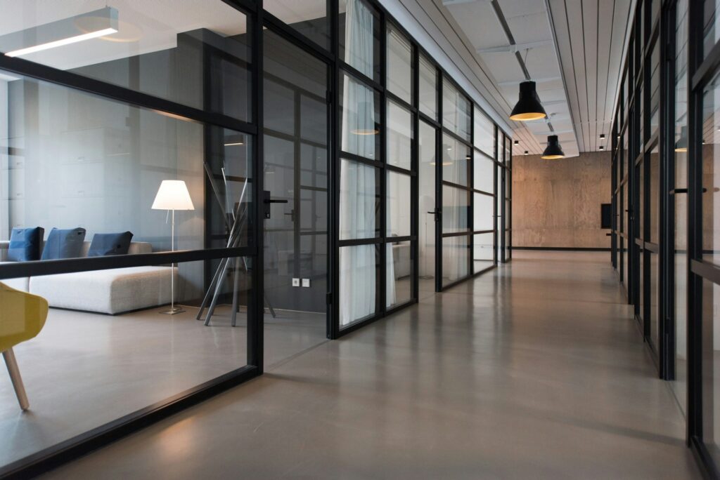 hallway between two modern meeting spaces in an office