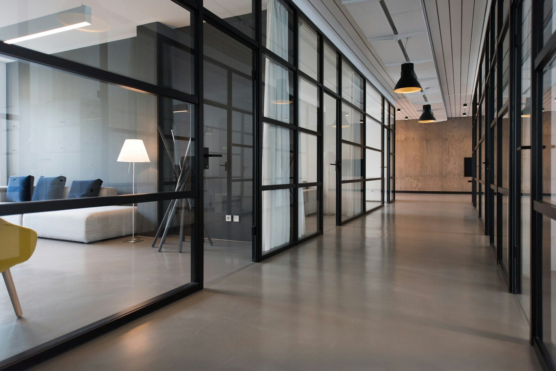 hallway between two modern meeting spaces in an office