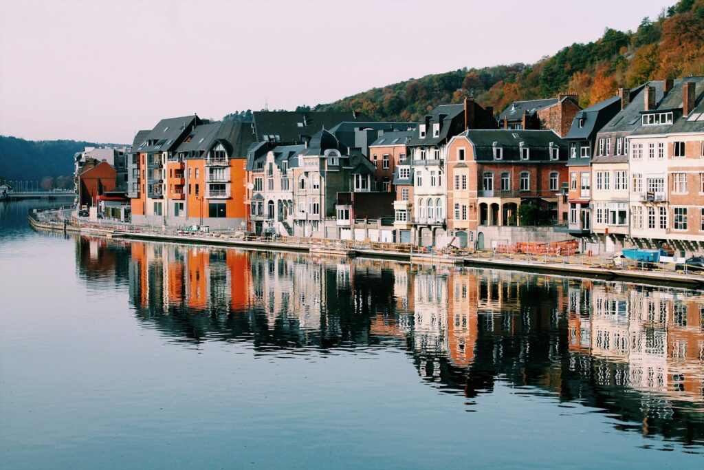 A canal with a row of houses in Belgium, representing the enforcement of foreign judgments in Ontario