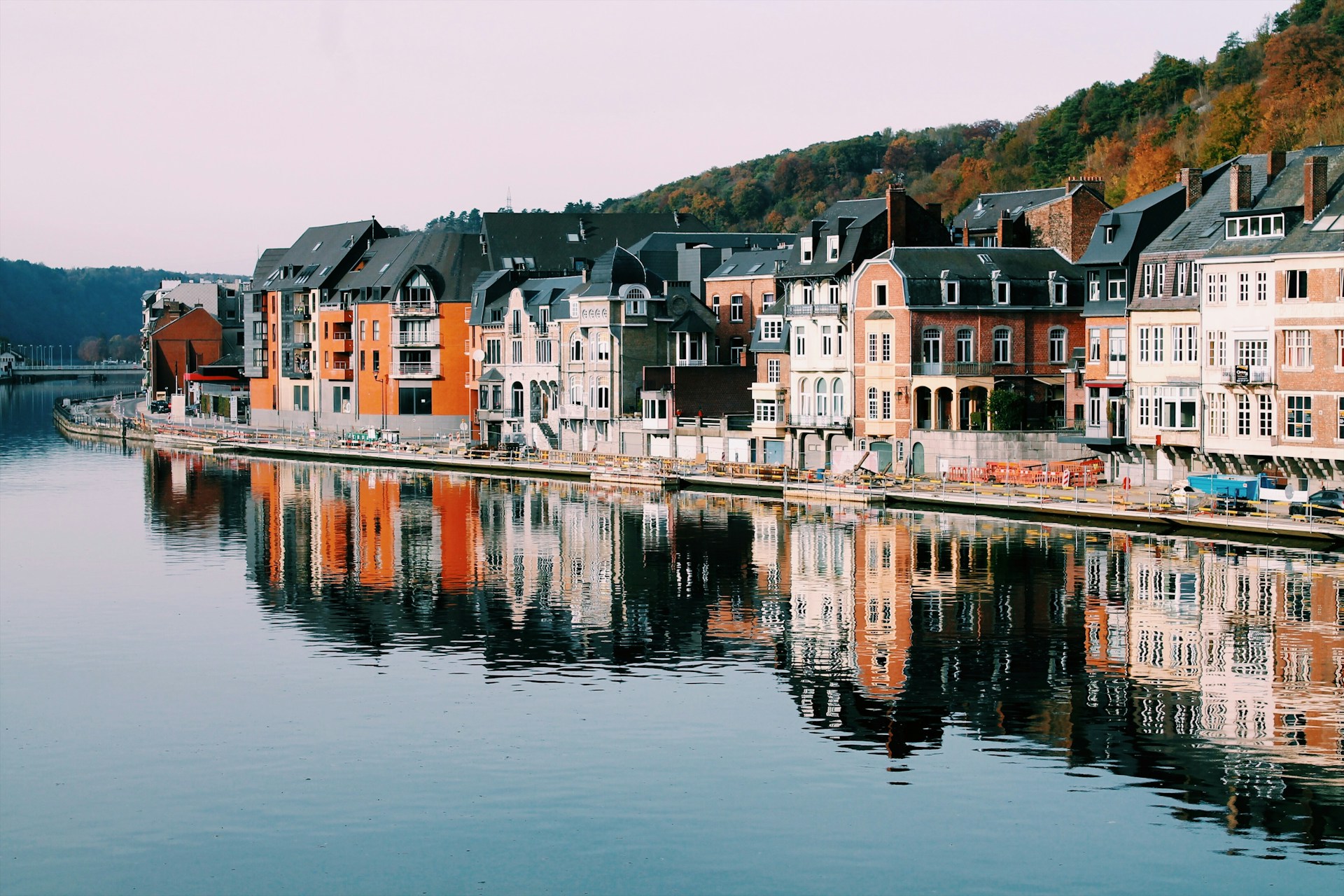 A canal with a row of houses in Belgium, representing the enforcement of foreign judgments in Ontario