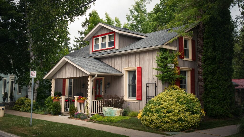 A charming house with red shutters on a tree-lined street, representing real estate disputes, partnership disagreements, and property trusts in Ontario