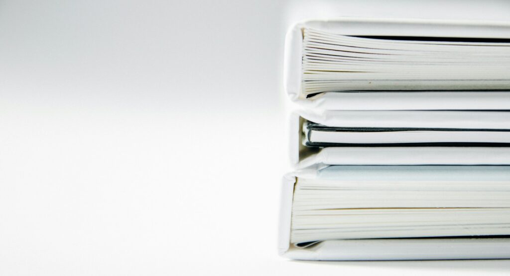 A stack of binders containing appeal documents, representing the Ontario Court of Appeal lawyers at Milosevic & Associates in Toronto.