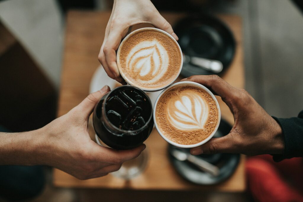 Three people holding cafe-like beverages which foreshawdows a blog topic on oppression claims and piercing the corporate veil.