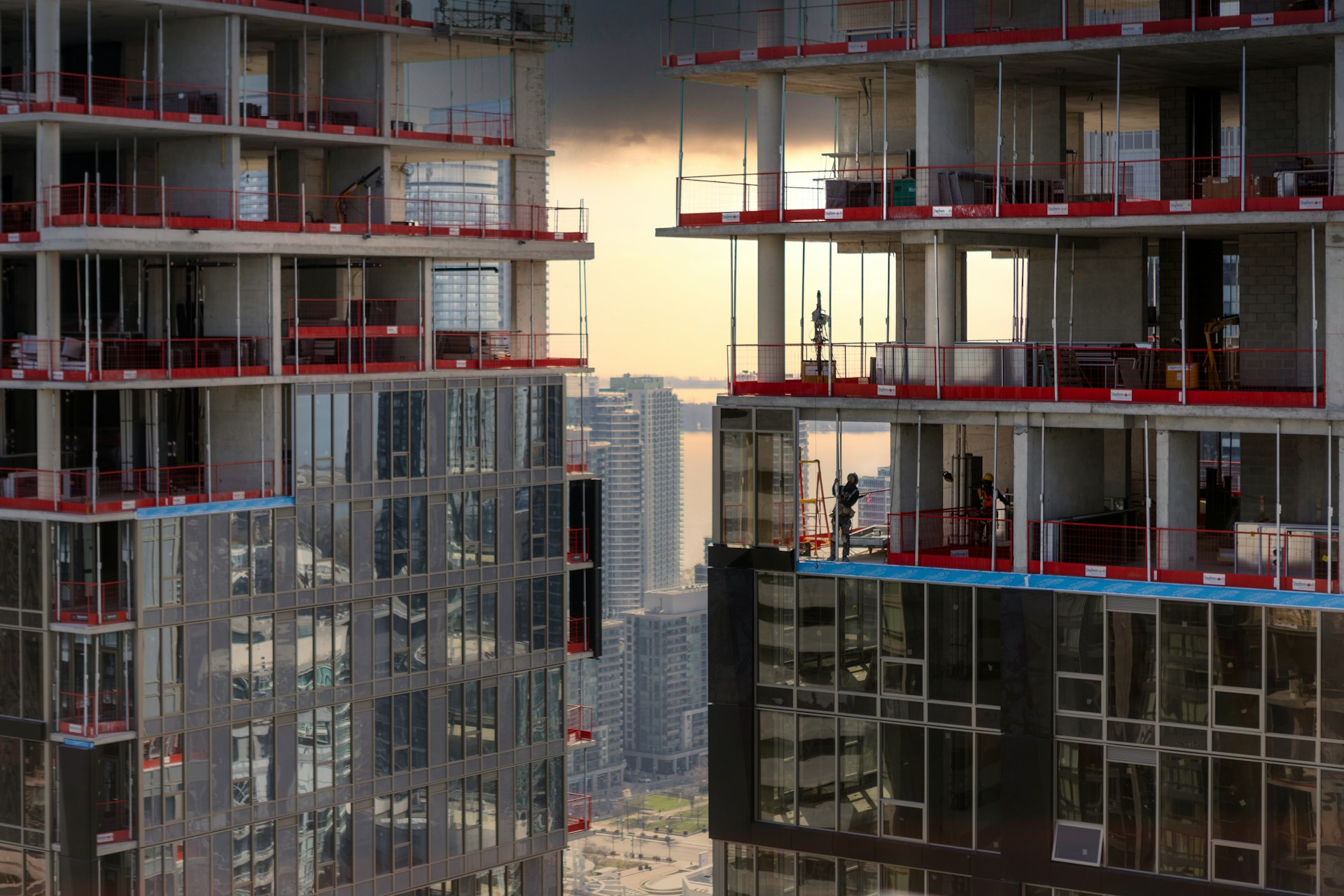 tall buildings in a city, being built represents certificates of pending litigation and construction loans
