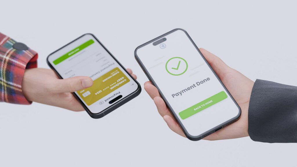 Two people holding their cellphones in their hands representing transfer of payment in asset recovery.