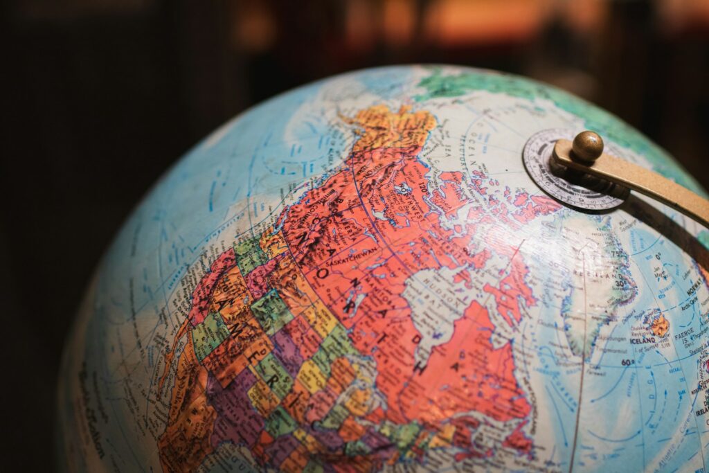 The top of a globe, showing most of North America, representing Cross-Border Judgment Enforcement.
