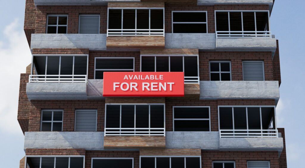 A condominium appartment building with a red 