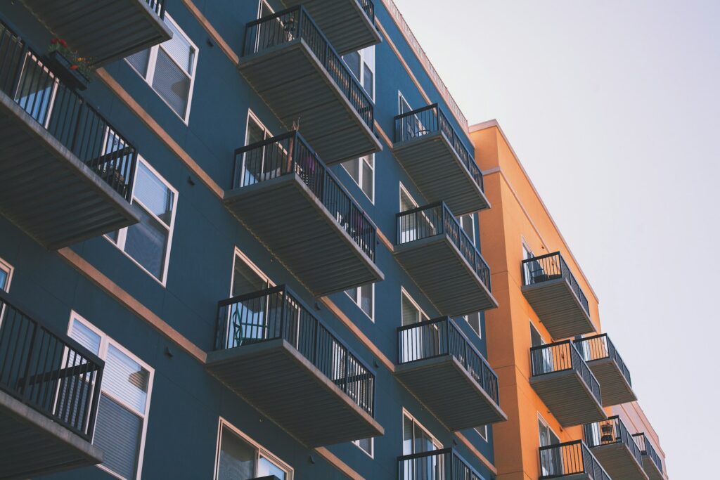 Rows of balconnies and a blue and orange appartment, representing mortgage fraud insurance.